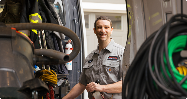 someone standing by a work van