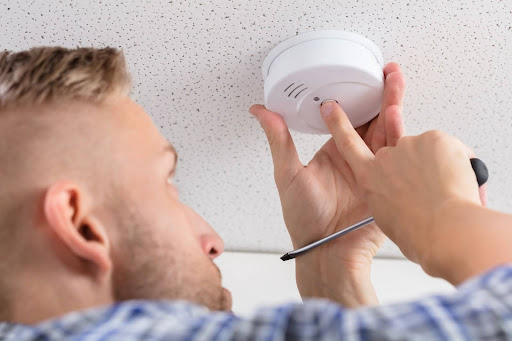 reynolds smoke detector Reynolds electrician installing smoke detector.