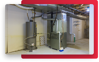 a water heater tank installed next to a furnace system in a basement